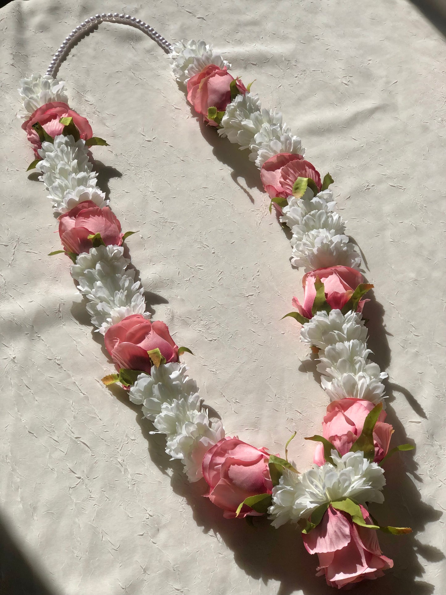 White flower and pink rose garland